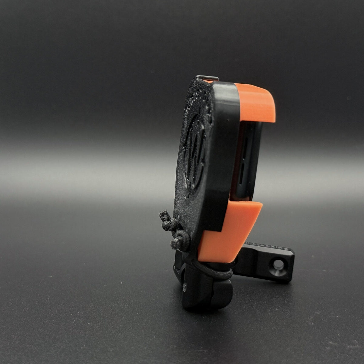 Cover fitted over a watch mount on a Hawk Hill holder, side view
