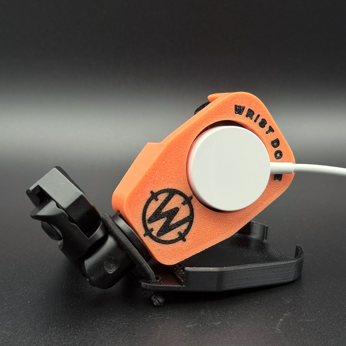 Charging puck fitted through the back of the watch mount